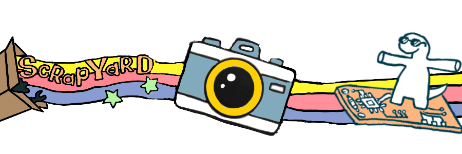 scrapyard box with rainbow coming out and envoloping a camera